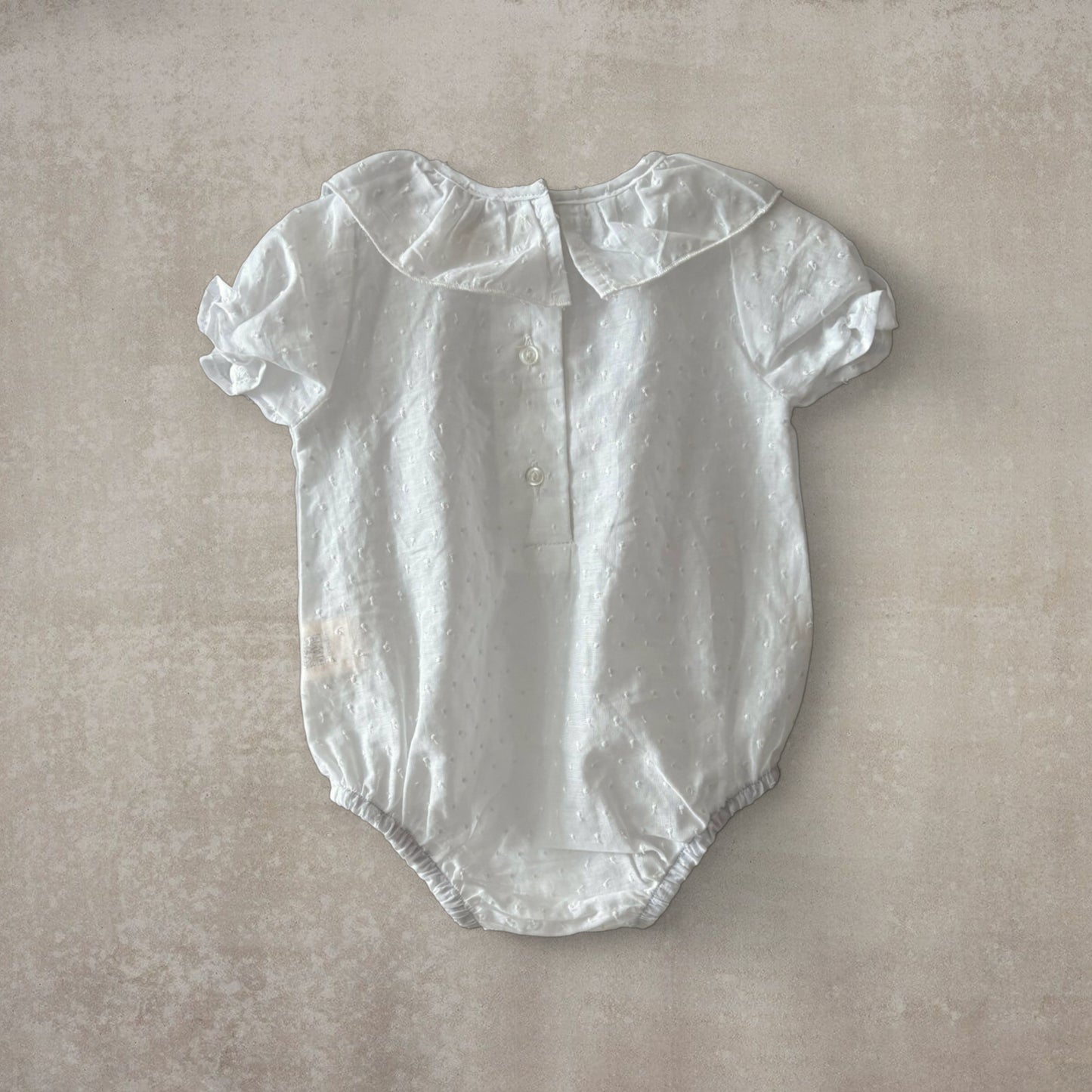 Camisa body plumeti. Manga corta