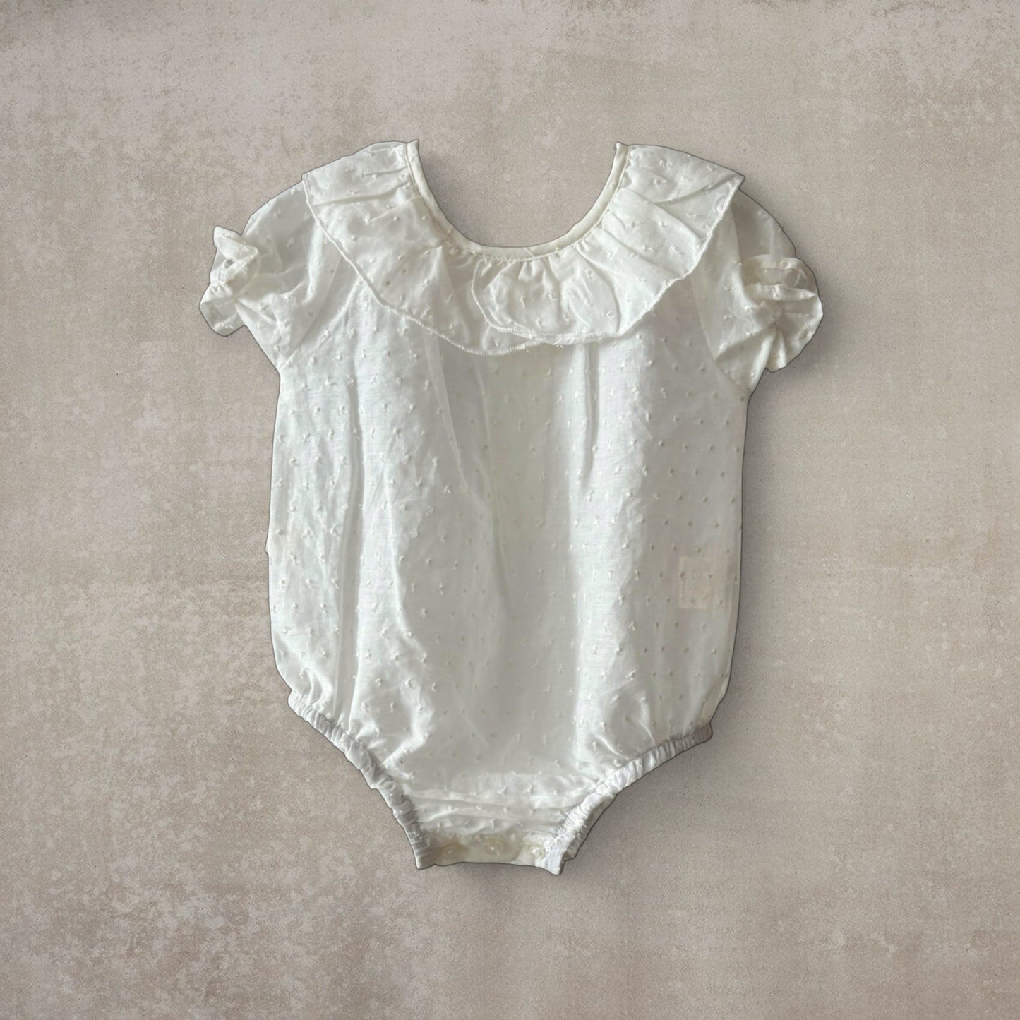 Camisa body plumeti. Manga corta