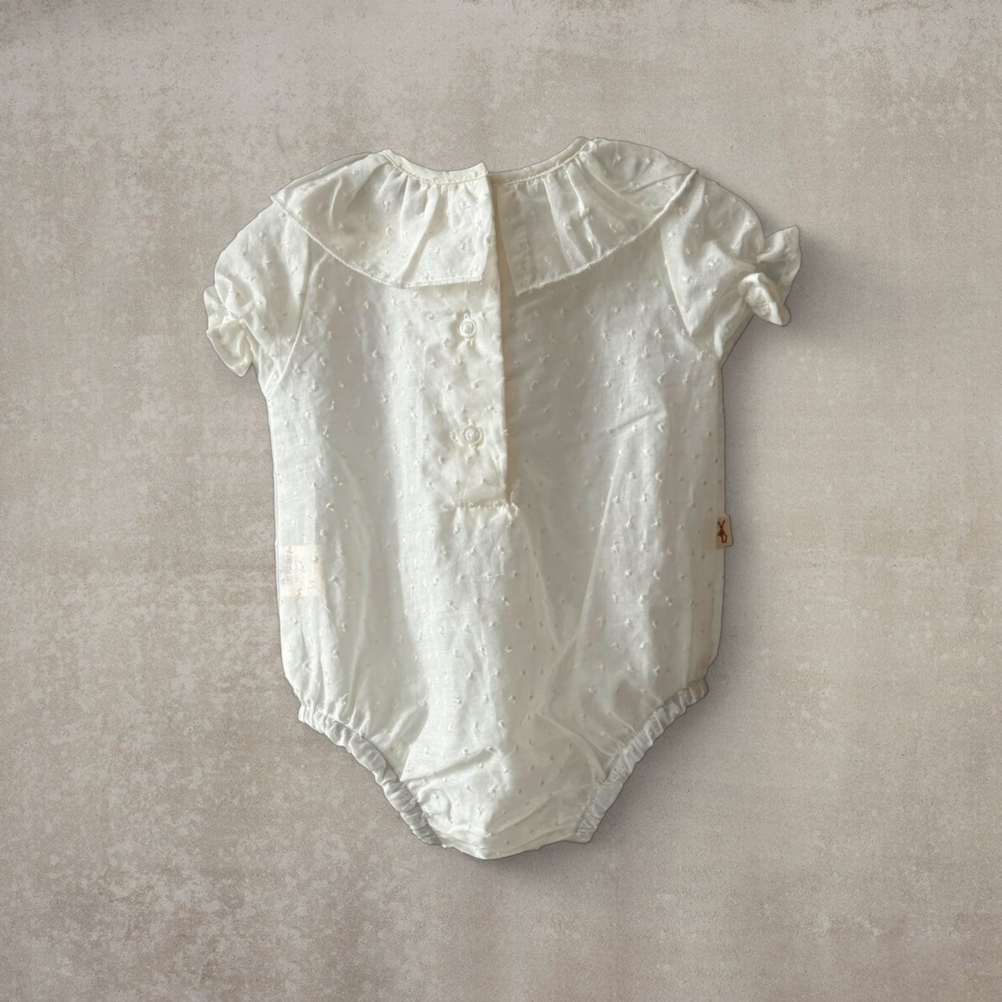 Camisa body plumeti. Manga corta