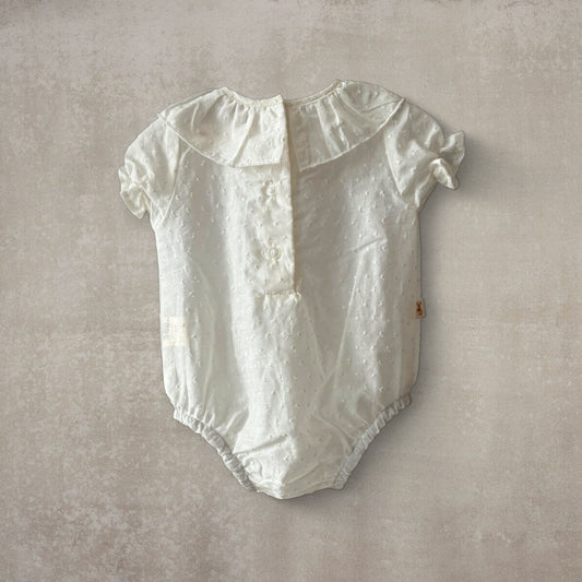 Camisa body plumeti. Manga corta